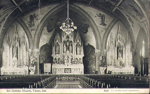 Interior of a Catholic church with candles lit
